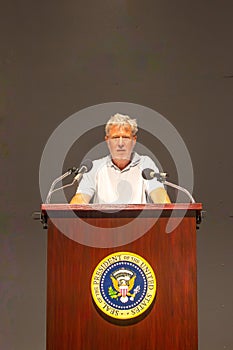 tourist at the lectern of John F. Kennedy with the seal of the president of the USA in the sixth floor museum in Dallas