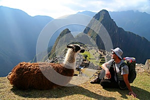 Tourist and llama in Machu Picchu