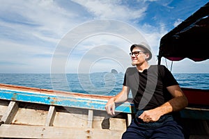 Tourist on longboat Koh Kradan