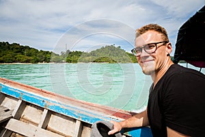 Tourist on longboat Koh Kradan