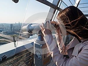 Tourist look observant binoculars telescope on panoramic view