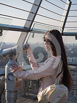 Tourist look observant binoculars telescope on panoramic view