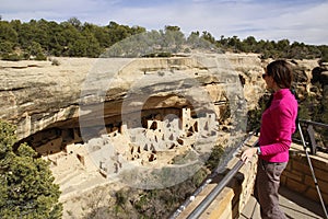 Tourist looking at Cliff Palace, Mesa Verde National Park, Color photo