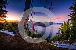 Tourist looking at Crater Lake Oregon Landscape