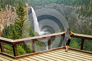 Tourist looking at Helmcken Falls in Wells Gray Provincial Park, British Columbia, Canada