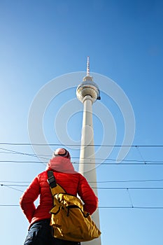 Tourist looking at TV Tower, Fernsehturm, Berlin