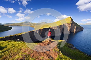 Tourist looks at Lake Sorvagsvatn or Leitisvatn of Vagar Island, Faroe Islands