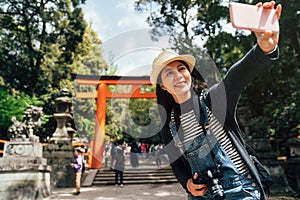 Tourist making self portrait kasuga taisha temple