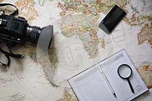 Tourist man looking at world map planning travel adventure