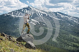 Tourist man photographer taking photos and enjoy the view of mountains in Yellowstone National Park