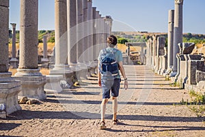 Tourist man at the ruins of ancient city of Perge near Antalya Turkey photo