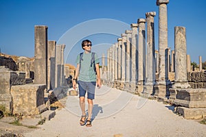 Tourist man at the ruins of ancient city of Perge near Antalya Turkey photo