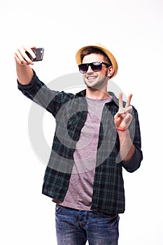 Tourist man taking selfie from phone on white background