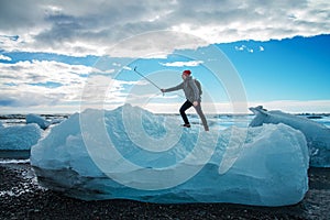 Tourist man taking selfie on small iceberg