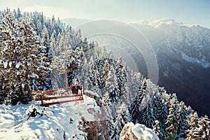 Tourist man travel to snowy mountains background