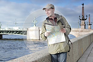 Tourist with a map in St. Petersburg, Russia