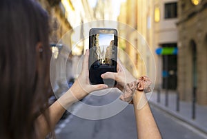 Tourist with mask taking photos in Barcelona. Tourism in Barcelona.