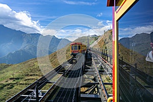 Tourist mountain tram, the transporation to Fansipan cable car station in Sapa town, Vietnam, with mountain landscape scene