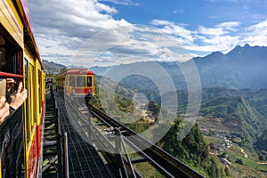 Tourist mountain tram, the transporation to Fansipan cable car station in Sapa town, Vietnam, with mountain landscape scene