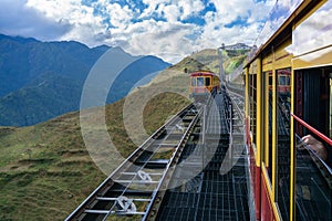 Tourist mountain tram, the transporation to Fansipan cable car station in Sapa town, Vietnam, with mountain landscape scene