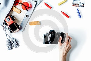 Tourist outfit and camera for trip with kids white background to