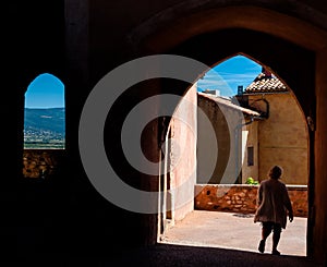 Tourist on passages arcs and windows in Roussillon in France