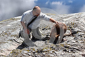 Tourist patting a kangaroo