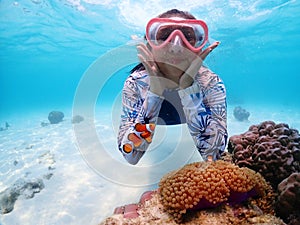 Tourist people diving with snorkel to see nemo fish , beautiful fish and coral at Samaesarn Island of Thailand