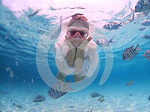 Tourist people diving with snorkel to see nemo fish , beautiful fish and coral at Samaesarn Island of Thailand