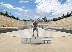 Tourist are photographed on the podium at the Panathenaic stadium