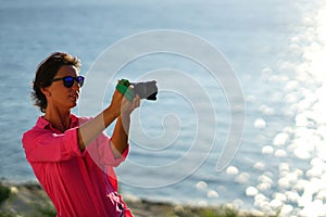 a tourist photographer in the city of Paroikia