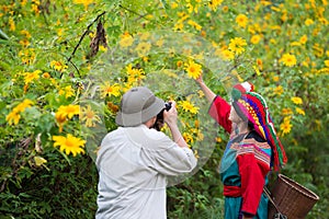 Tourist photographer friendship with local hill tribe