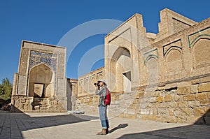 Tourist photographer in the memorial complex of Chor-Bakr