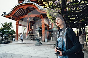 Tourist photographer taking photo by slr camera