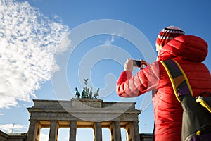 Tourist photographing Brandenburg gate, Berlin