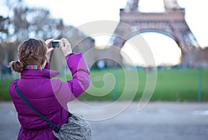 Tourist photographing the Eiffel Tower