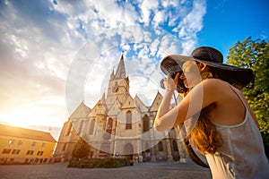 Tourist photographing ghotic cathedral in Romania