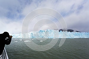 Tourist photographing Perito Morino Glacier