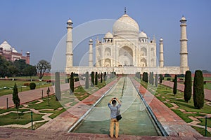 Tourist photographing Taj Mahal in Agra, Uttar Pradesh, India