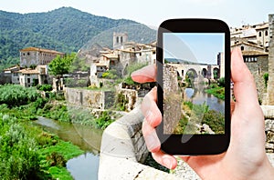 Tourist photographs of bridge in Besalu town