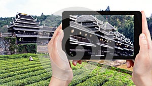 tourist photographs Chengyang Wind and Rain Bridge