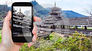 tourist photographs pagoda on Chengyang bridge