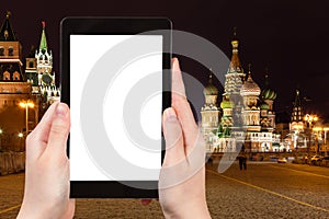 Tourist photographs Red Square in night, Moscow