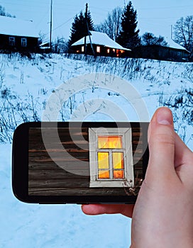 Tourist photographs of window of rural house