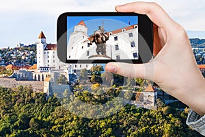 Tourist photos statue in Bratislava Hrad castle