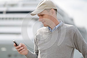 Tourist reading SMS