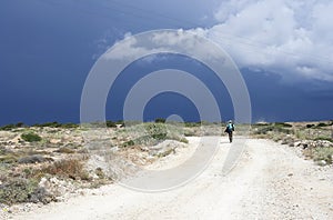 Tourist on a rural road in Koufonissi island