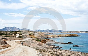 Tourist on a rural winding road in Koufonissi island