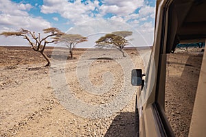 Tourist safari vehicle seen driving in the desert at Loiyangalani District in Turkana County