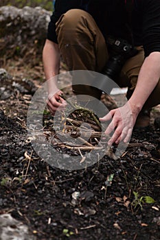 Tourist is setting campfire